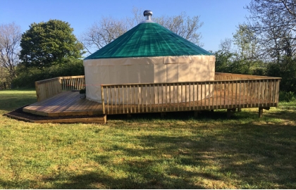 Customized Mongolian yurt with green roof and light yellow walls